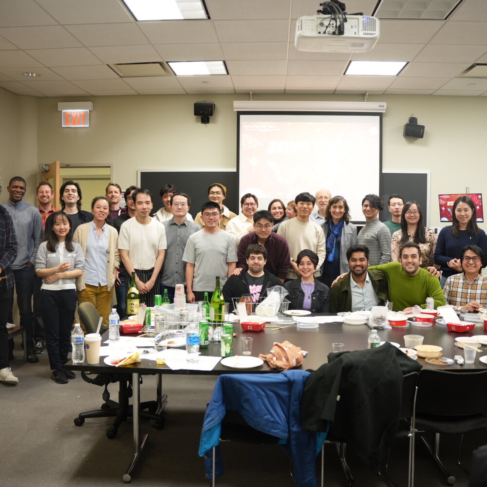 Faculty and graduate colleagues at an economics gathering